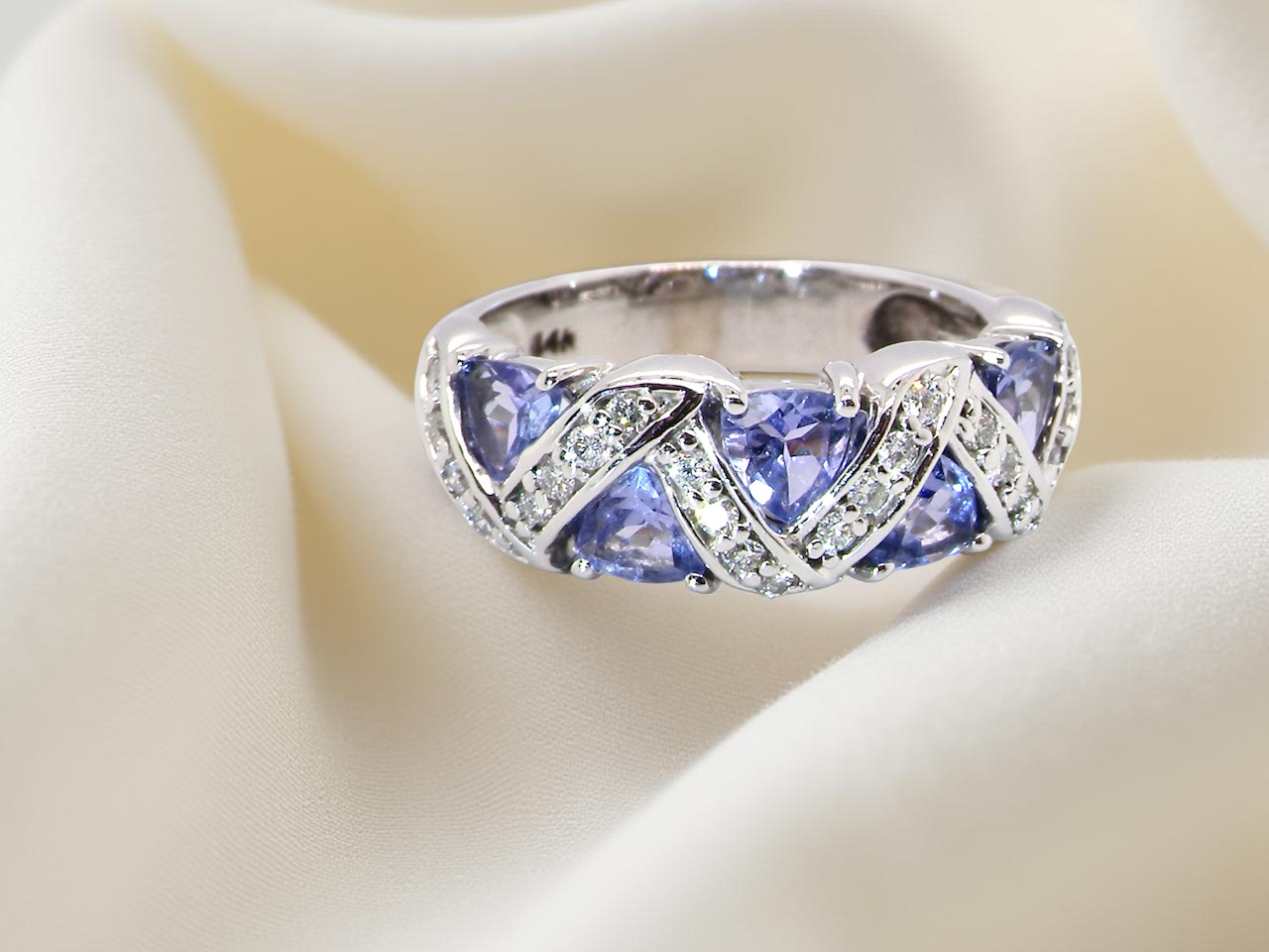 beautiful and eye-catching dress ring set in 14ct white gold, featuring triangular tanzanite gemstones
