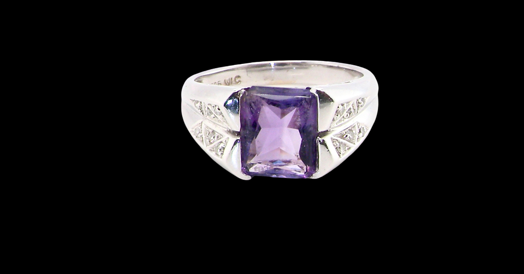 beautiful dress ring crafted in 14ct white gold (stamped 585), featuring a stunning rectangular-cut Tanzanite measuring approximately 9 x 7.5mm,