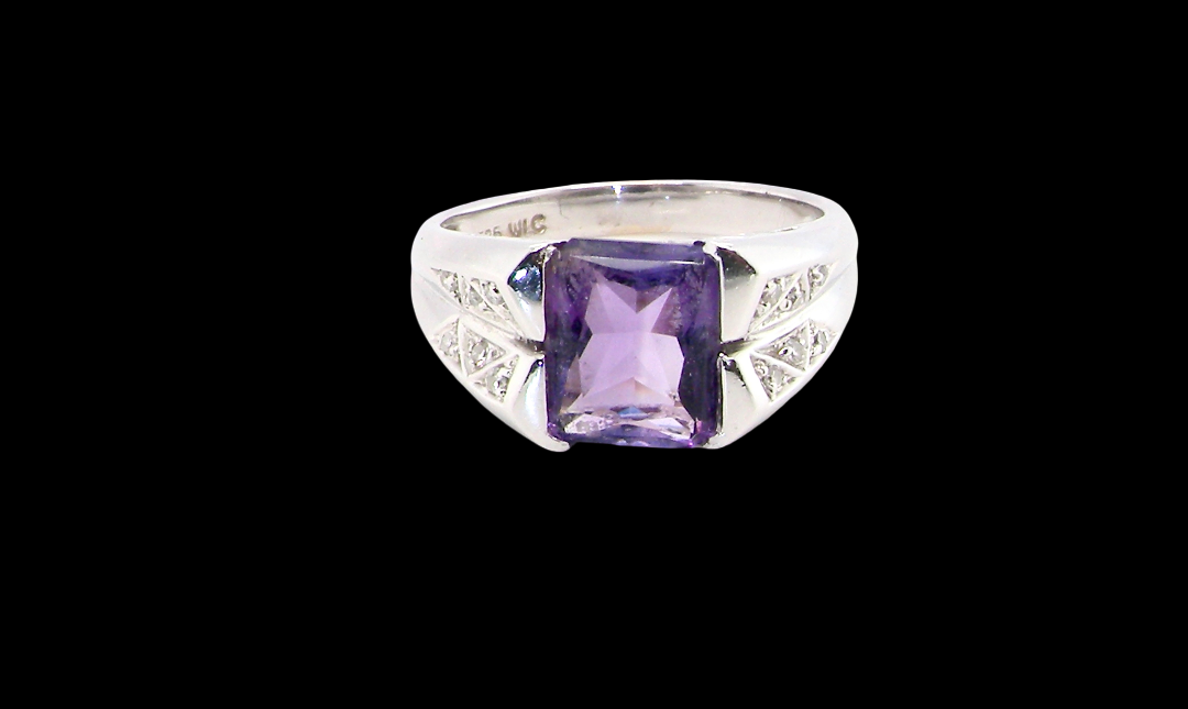 beautiful dress ring crafted in 14ct white gold (stamped 585), featuring a stunning rectangular-cut Tanzanite measuring approximately 9 x 7.5mm,