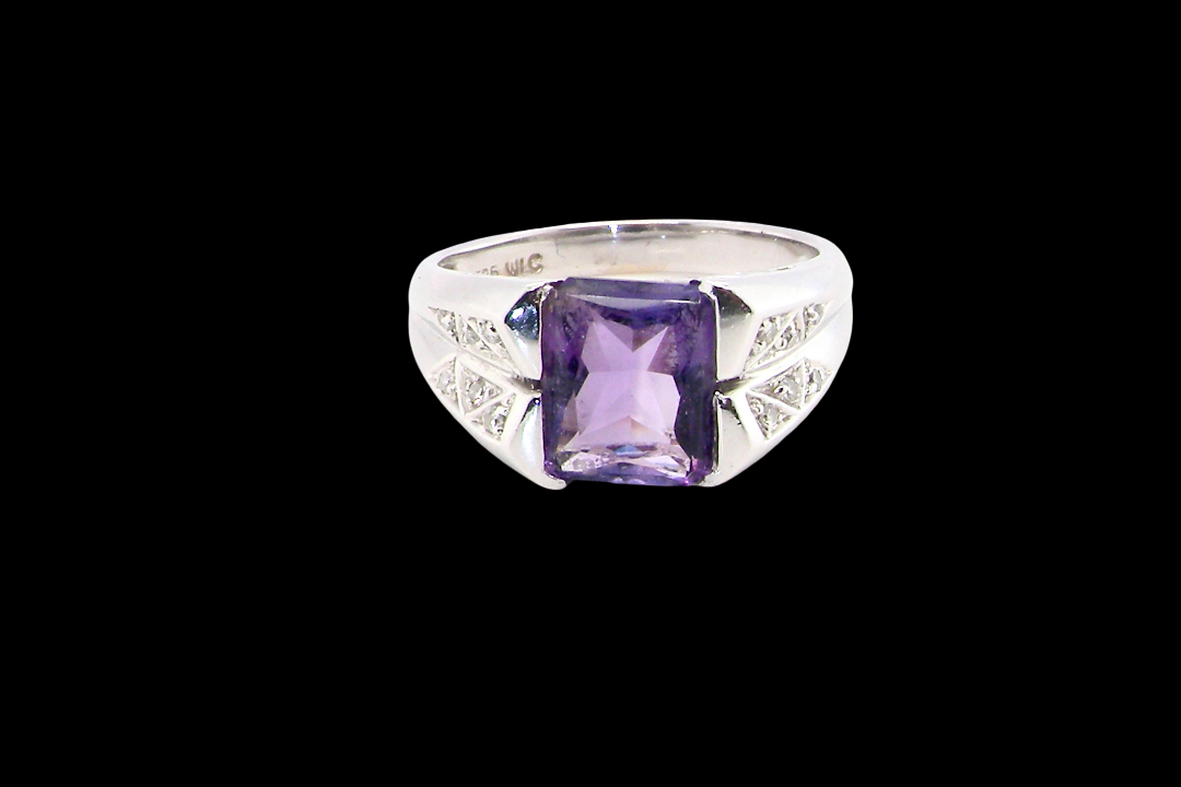 beautiful dress ring crafted in 14ct white gold (stamped 585), featuring a stunning rectangular-cut Tanzanite measuring approximately 9 x 7.5mm,