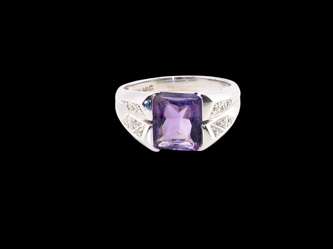 beautiful dress ring crafted in 14ct white gold (stamped 585), featuring a stunning rectangular-cut Tanzanite measuring approximately 9 x 7.5mm,