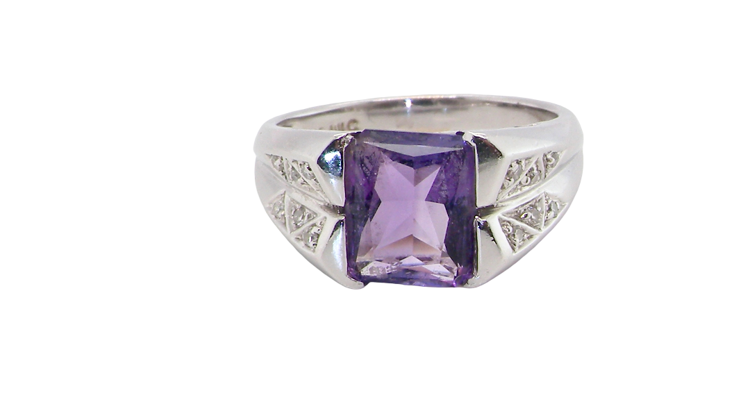 beautiful dress ring crafted in 14ct white gold (stamped 585), featuring a stunning rectangular-cut Tanzanite measuring approximately 9 x 7.5mm, estimated at 2.5 carats.