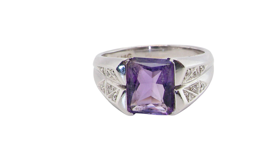 beautiful dress ring crafted in 14ct white gold (stamped 585), featuring a stunning rectangular-cut Tanzanite measuring approximately 9 x 7.5mm, estimated at 2.5 carats.