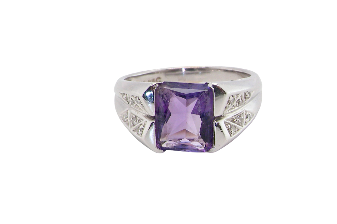 beautiful dress ring crafted in 14ct white gold (stamped 585), featuring a stunning rectangular-cut Tanzanite measuring approximately 9 x 7.5mm, estimated at 2.5 carats.