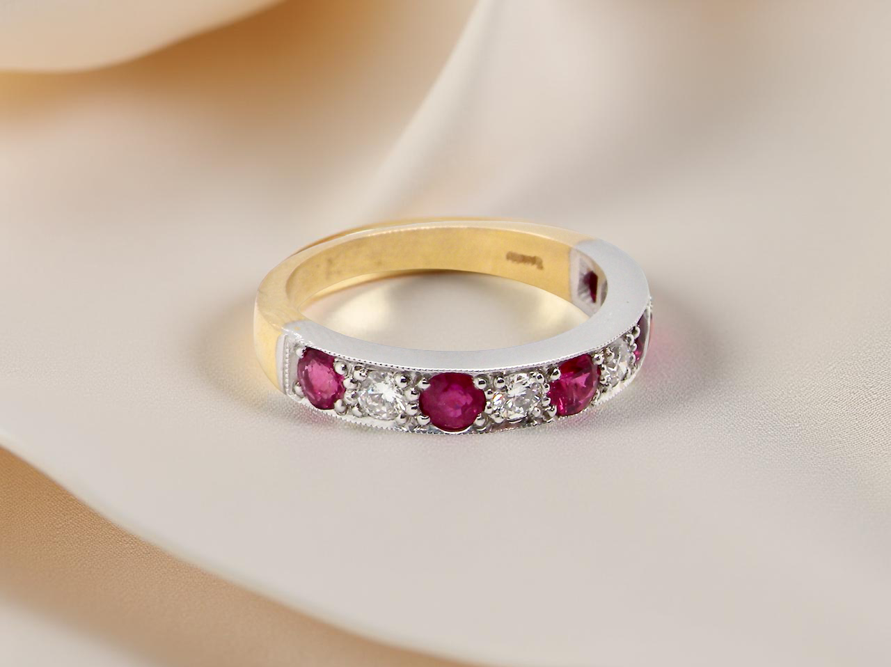 beautifully crafted 18 carat gold half-hoop eternity ring, A