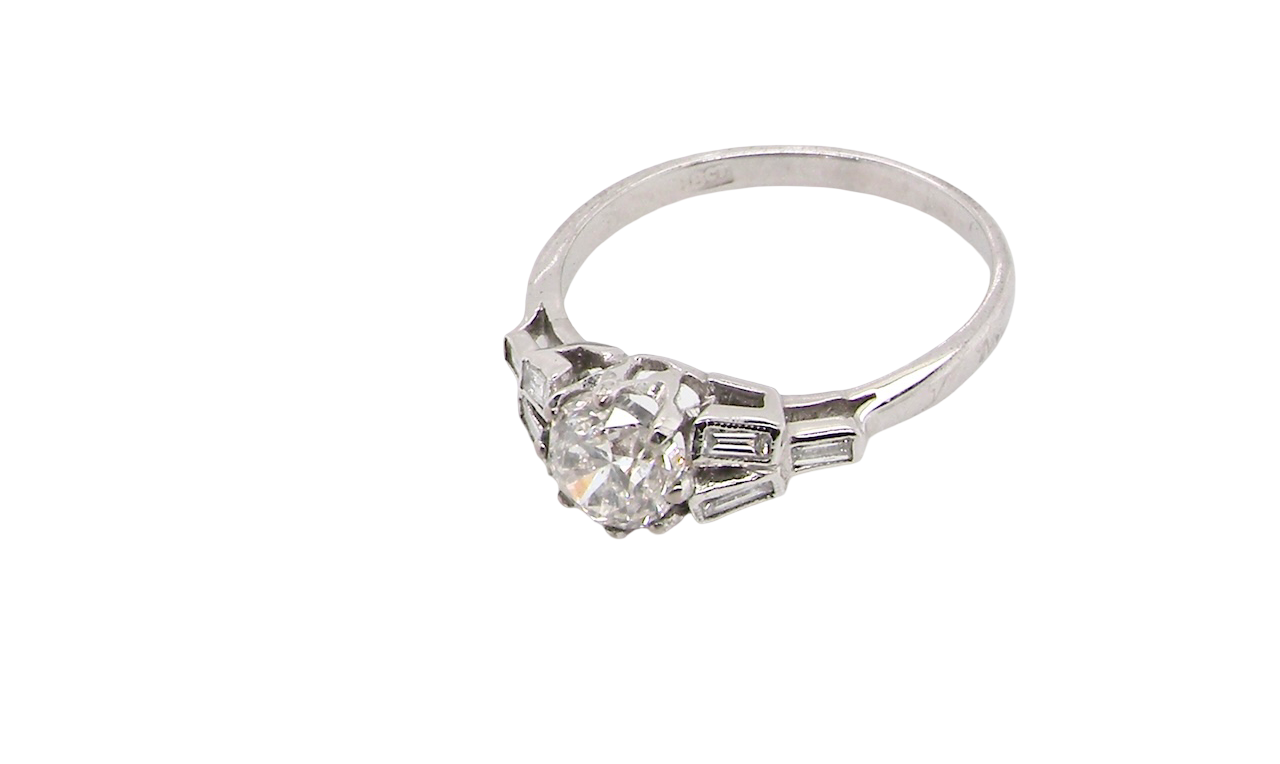 beautifully proportioned Art Deco solitaire ring showcasing a sparkling old brilliant cut white diamond