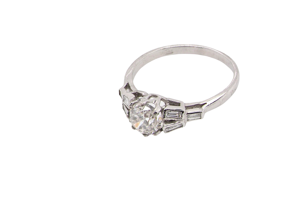 beautifully proportioned Art Deco solitaire ring showcasing a sparkling old brilliant cut white diamond