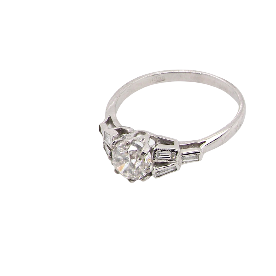 beautifully proportioned Art Deco solitaire ring showcasing a sparkling old brilliant cut white diamond