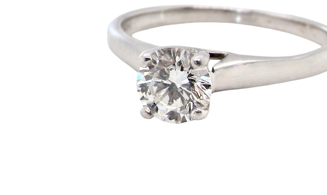 close up solitaire ring containing a fine modern brilliant cut white diamond. Measures 5.4mm (.53 carats)
Colour G-h, clarity Si. Modern feature under setting, depth 6.8mm, weight 2.6grams.