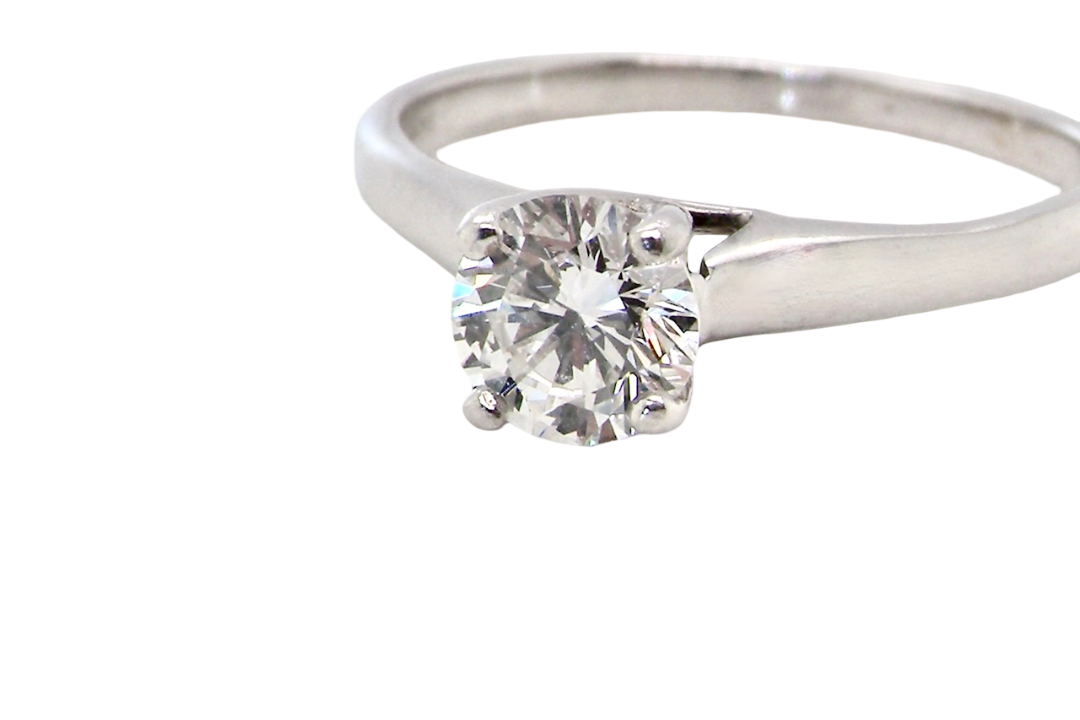 close up solitaire ring containing a fine modern brilliant cut white diamond. Measures 5.4mm (.53 carats)
Colour G-h, clarity Si. Modern feature under setting, depth 6.8mm, weight 2.6grams.