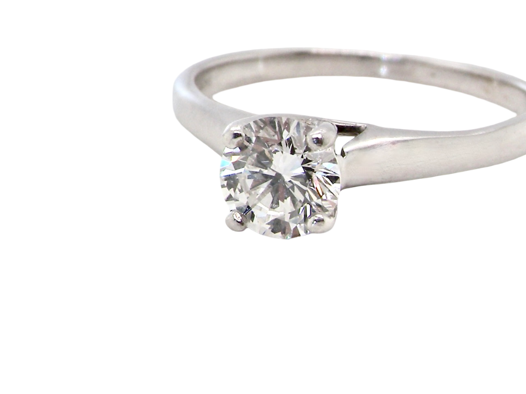 close up solitaire ring containing a fine modern brilliant cut white diamond. Measures 5.4mm (.53 carats)
Colour G-h, clarity Si. Modern feature under setting, depth 6.8mm, weight 2.6grams.