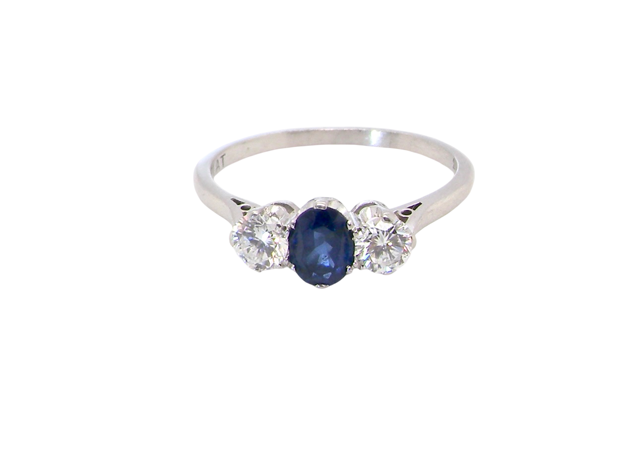 classic trilogy ring set with an exquisite oval cut sapphire centre stone, hues of deep blue colour and measuring 6x4.2mm (est approx 0.50 carats)