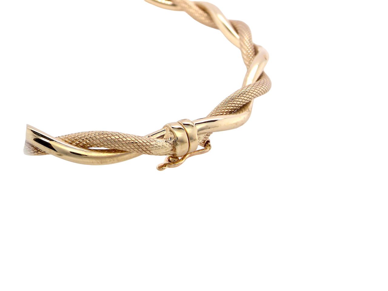 close up A double twist of a plain band entwined around a filagree band to add strength and beauty to this very wearable piece of jewellery.