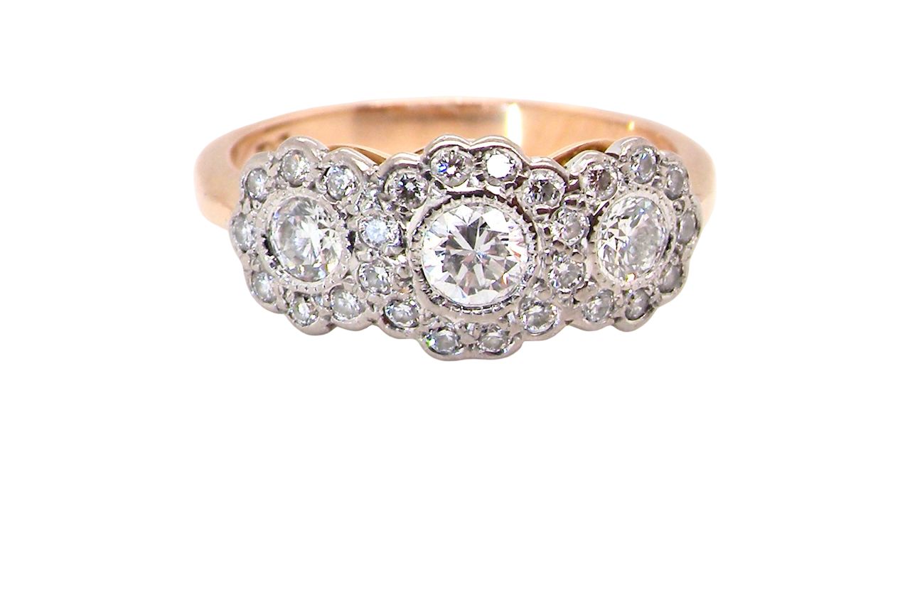 close up charming vintage triple cluster diamond ring,