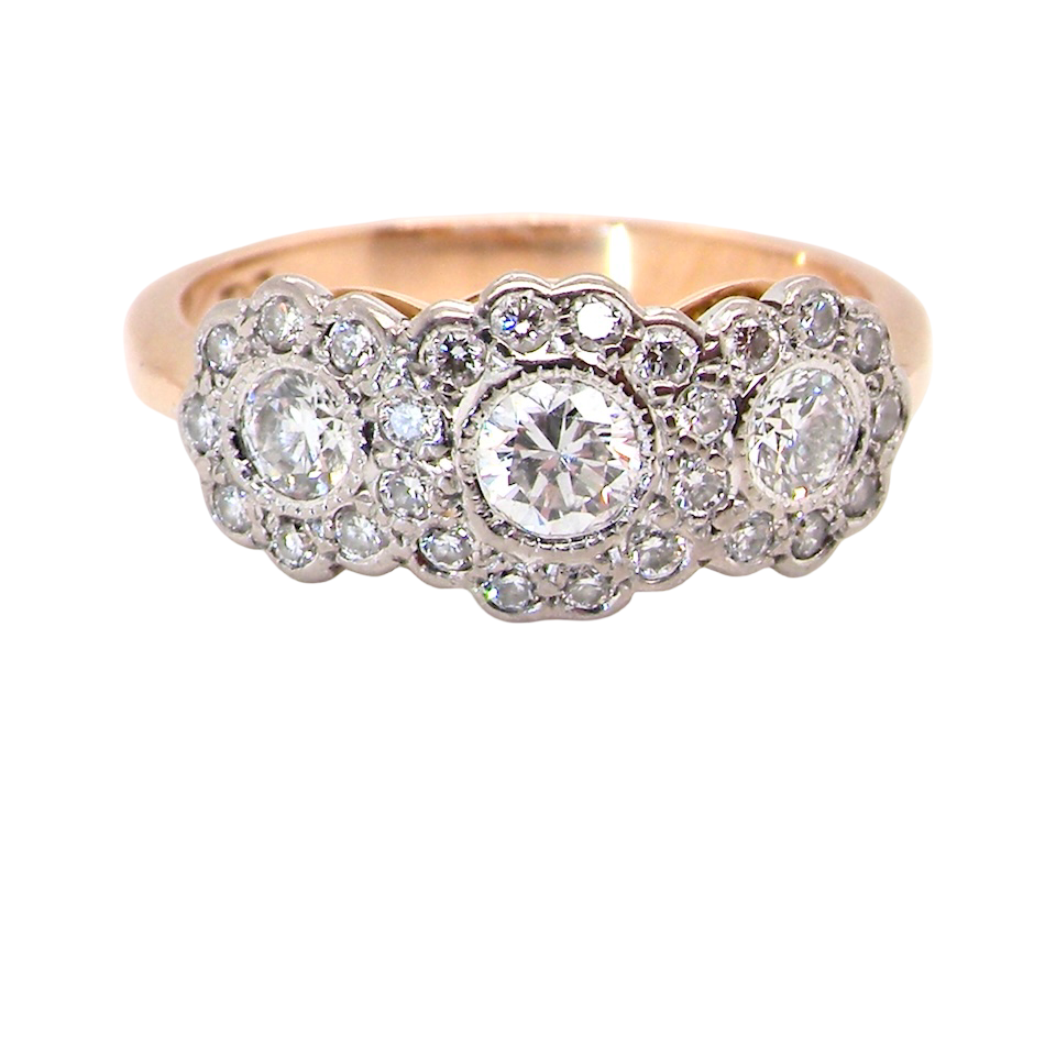 close up charming vintage triple cluster diamond ring,
