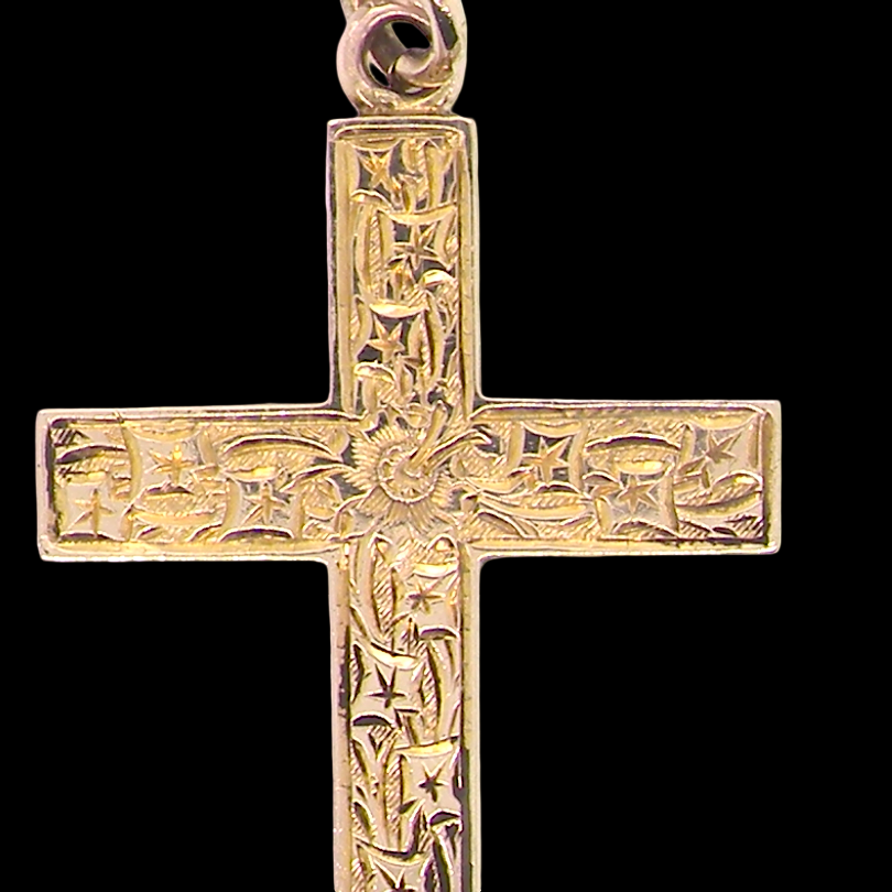 close view A fine 9 carat gold cross. Hand engrarved across the whole body of the cross which measures 45x25mm