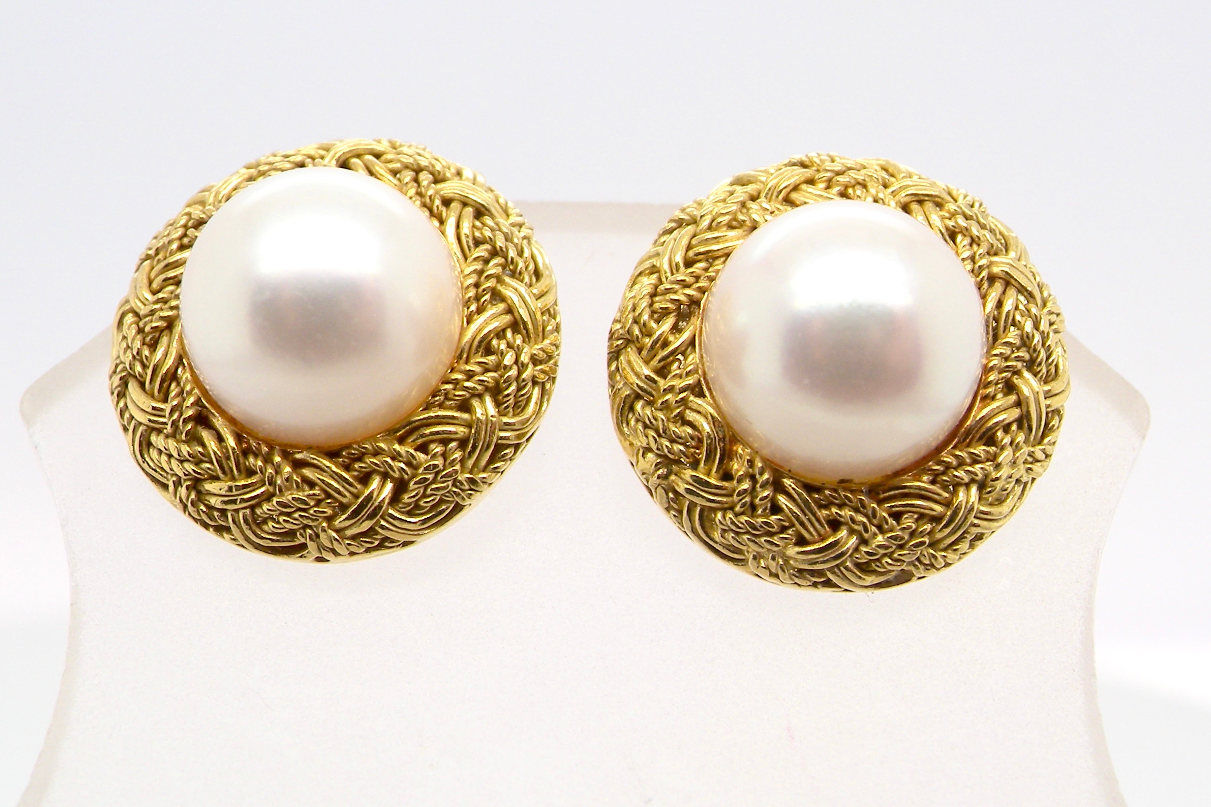 close view A lovely pair of elegant earrings, each set with a 7.7 mm cultured pearl.
