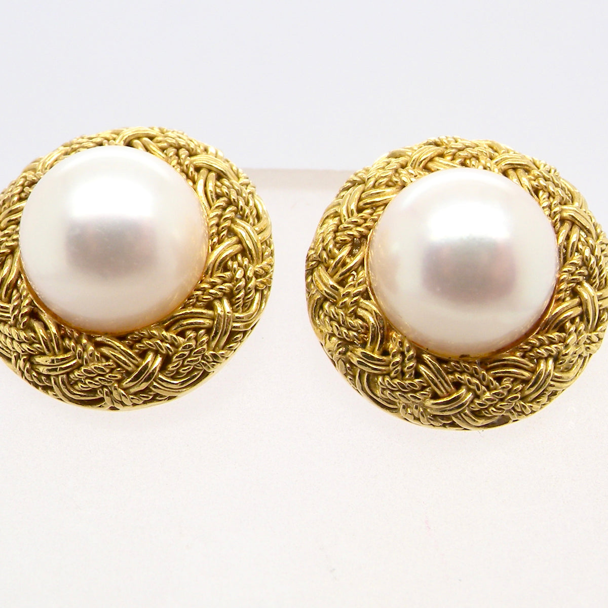 close view A lovely pair of elegant earrings, each set with a 7.7 mm cultured pearl.