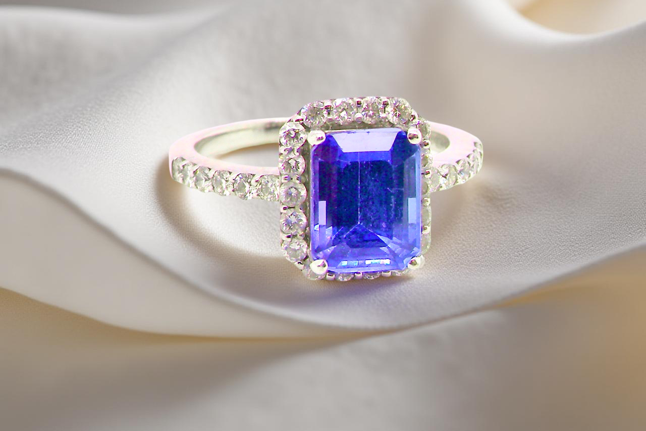 cluster ring featuring a 4A quality Tanzanite as its centre stone. B