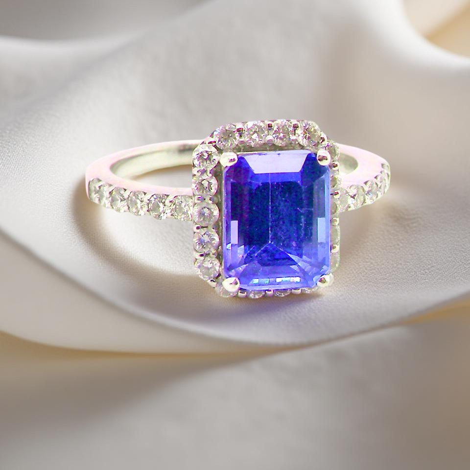 cluster ring featuring a 4A quality Tanzanite as its centre stone. B