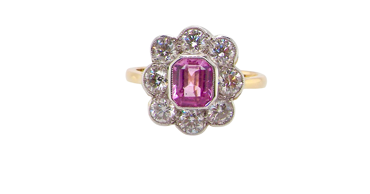 cluster ring featuring a beautiful cushion-cut pink sapphire