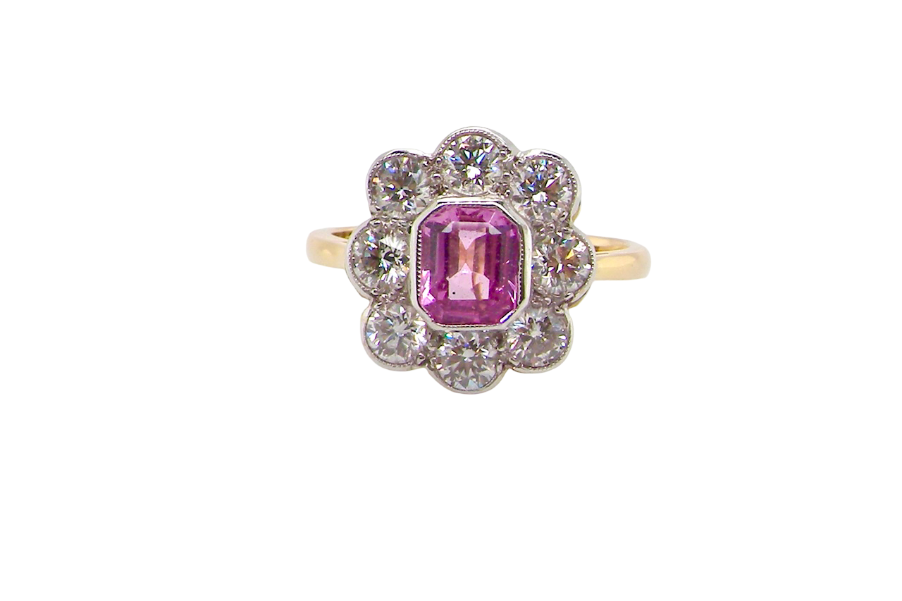 cluster ring featuring a beautiful cushion-cut pink sapphire