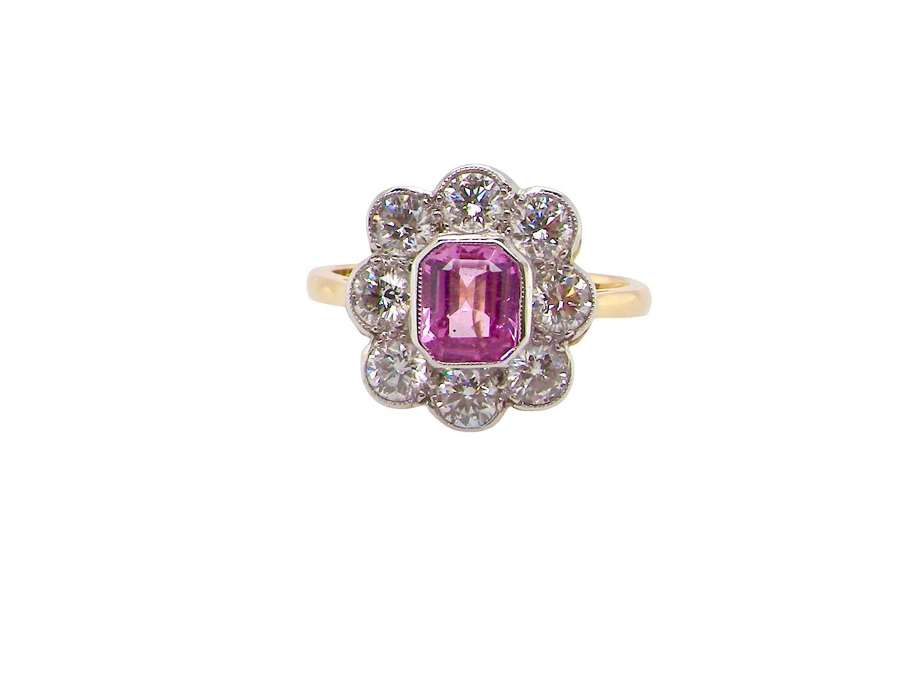 cluster ring featuring a beautiful cushion-cut pink sapphire