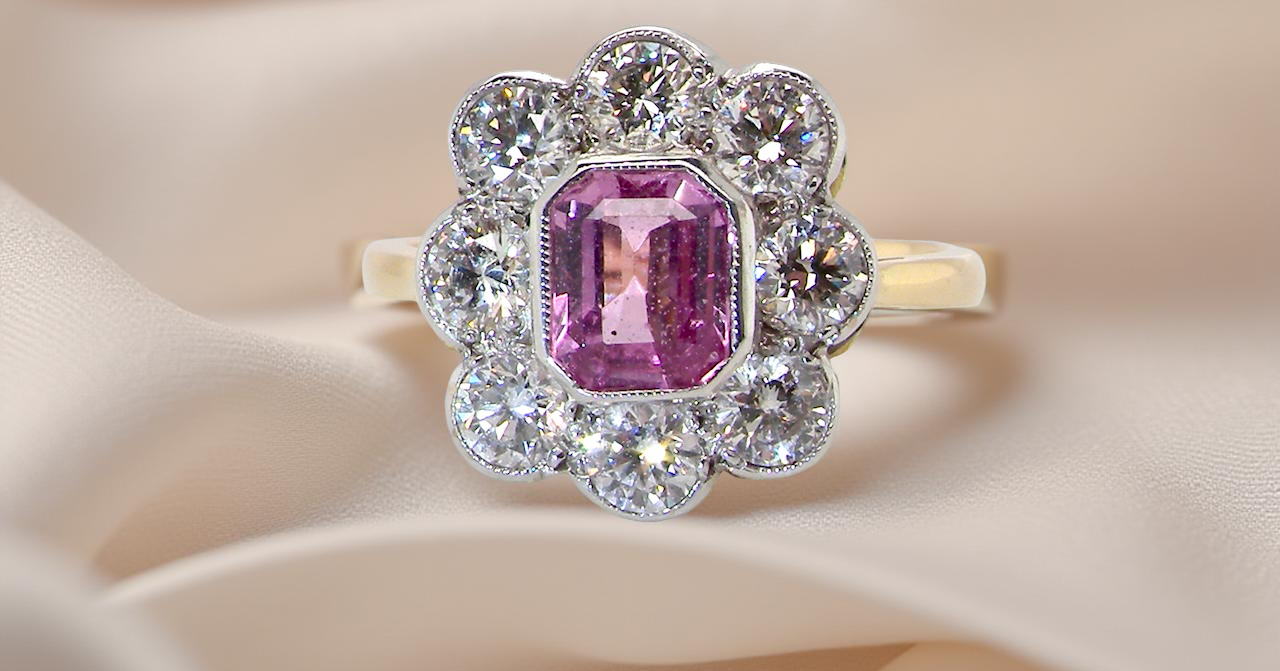 cluster ring featuring a beautiful cushion-cut pink sapphire B