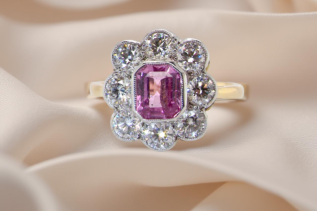 cluster ring featuring a beautiful cushion-cut pink sapphire B