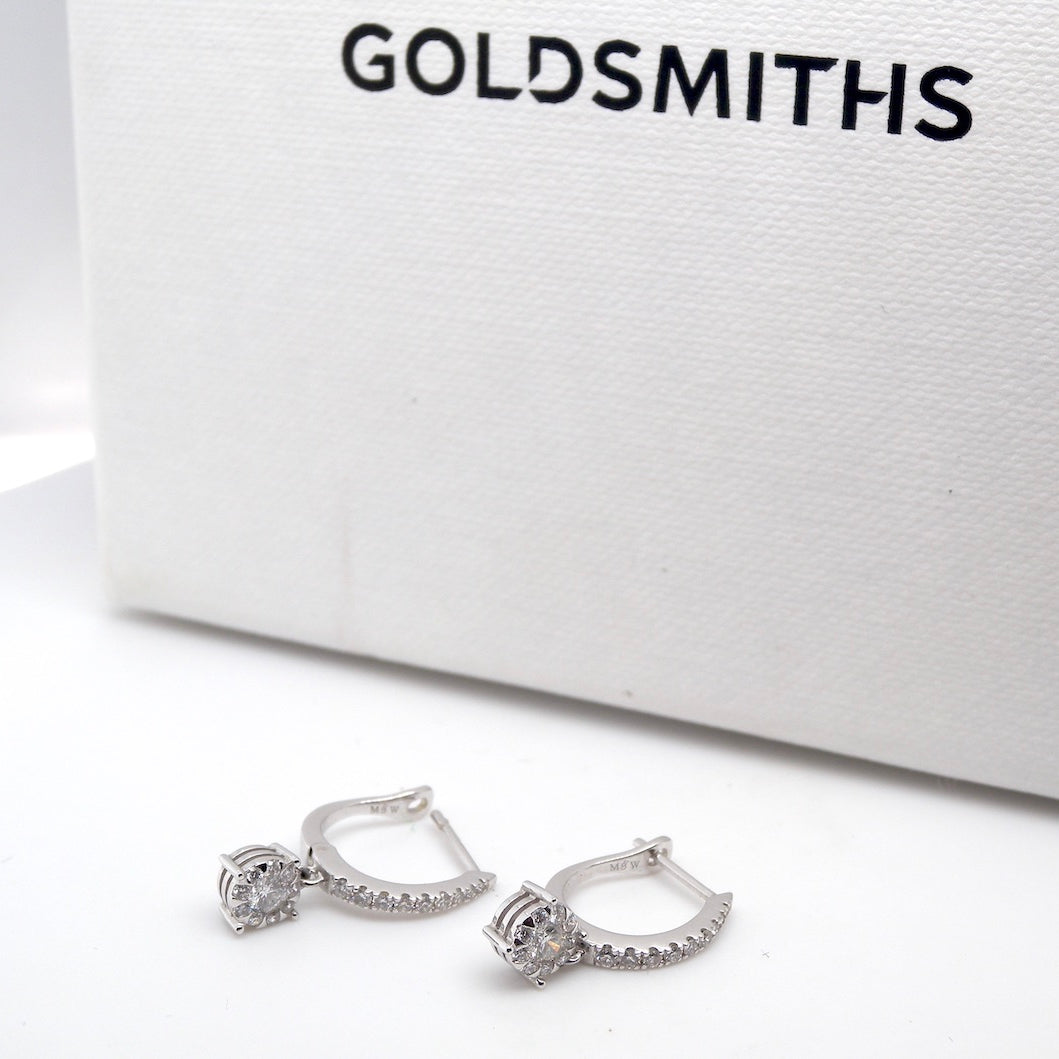 A pair of diamond hoop and drop earrings