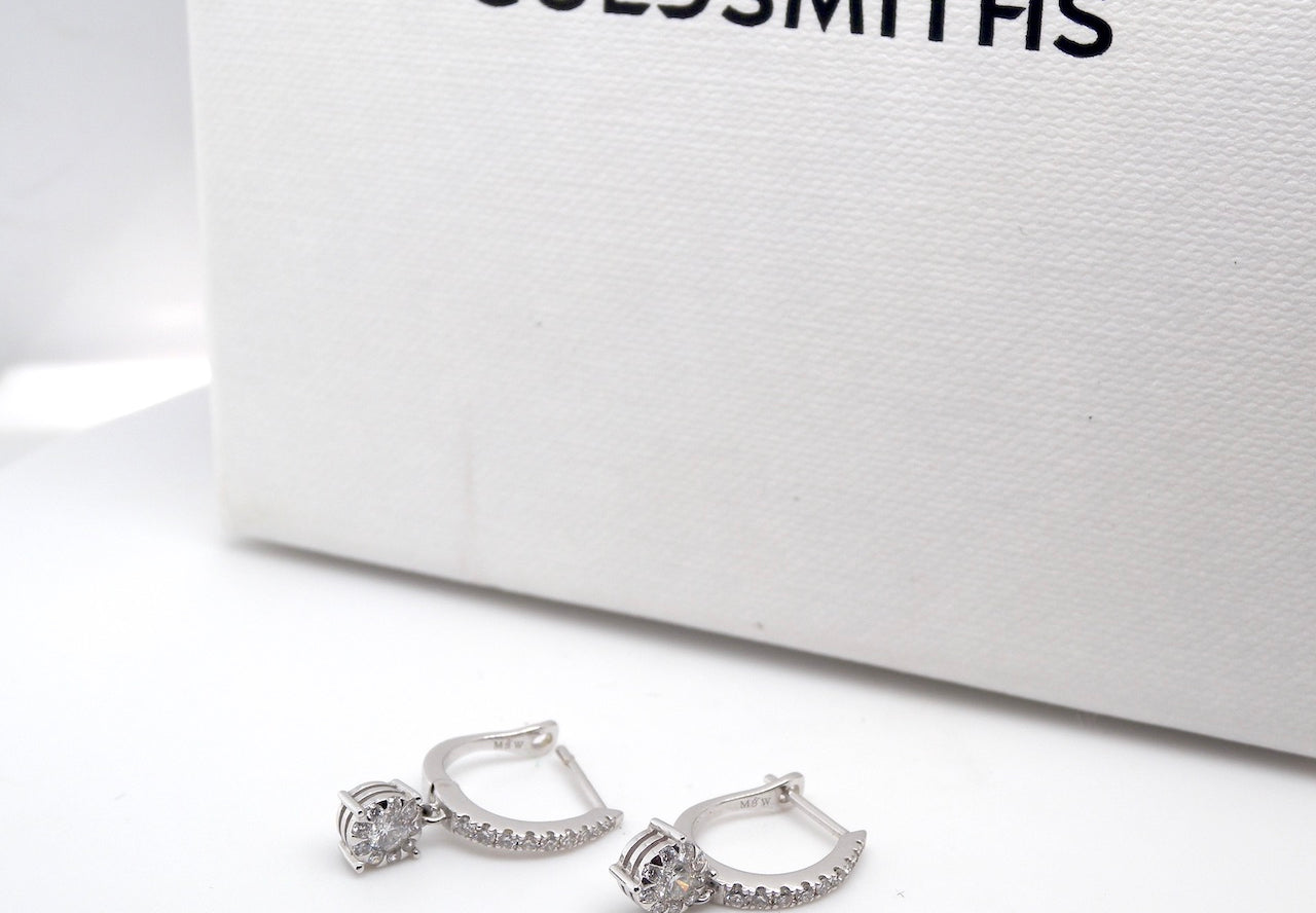 A pair of diamond hoop and drop earrings