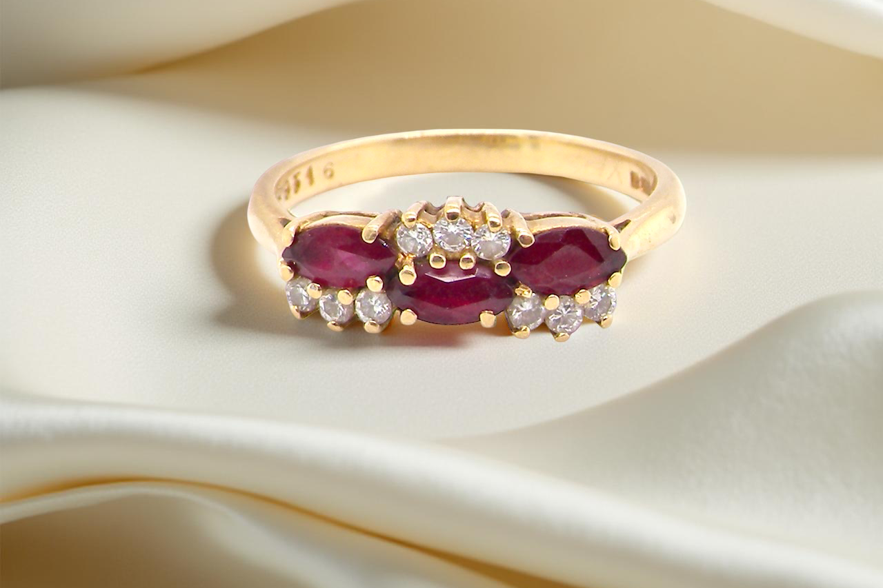 diamond ring with marquise-cut rubies (5×3 mm each).