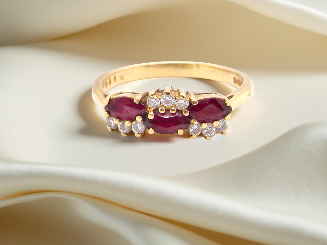 diamond ring with marquise-cut rubies (5×3 mm each).
