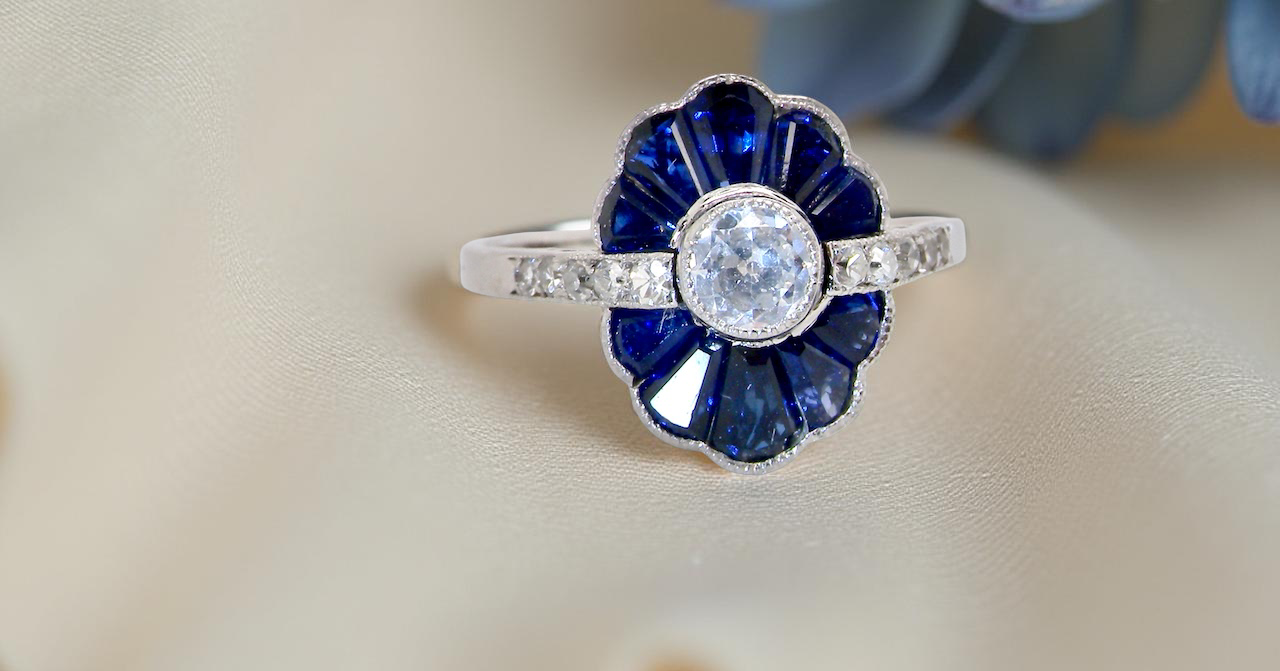 cluster ring featuring a distinctive fan-shaped design.