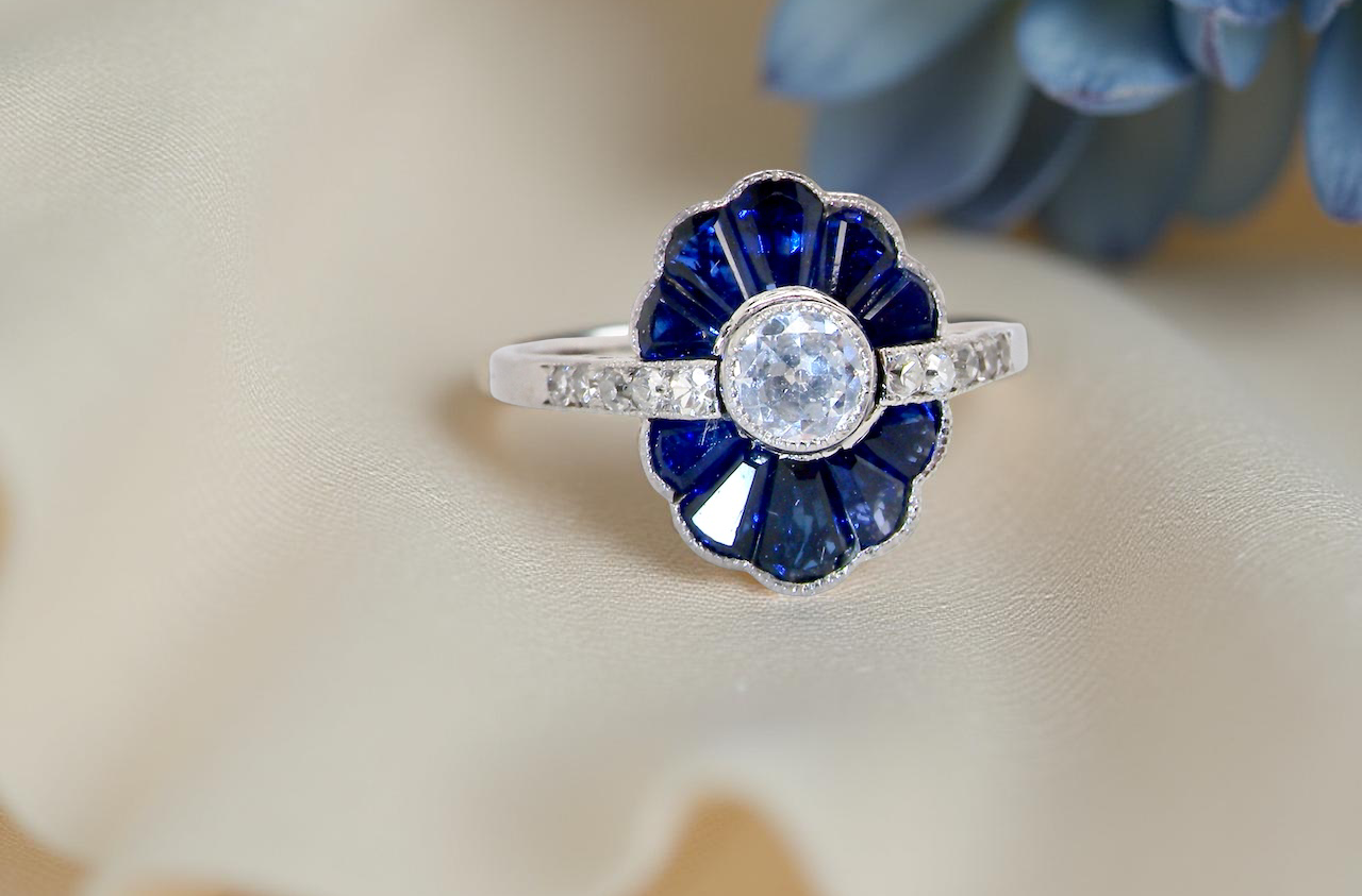 cluster ring featuring a distinctive fan-shaped design.