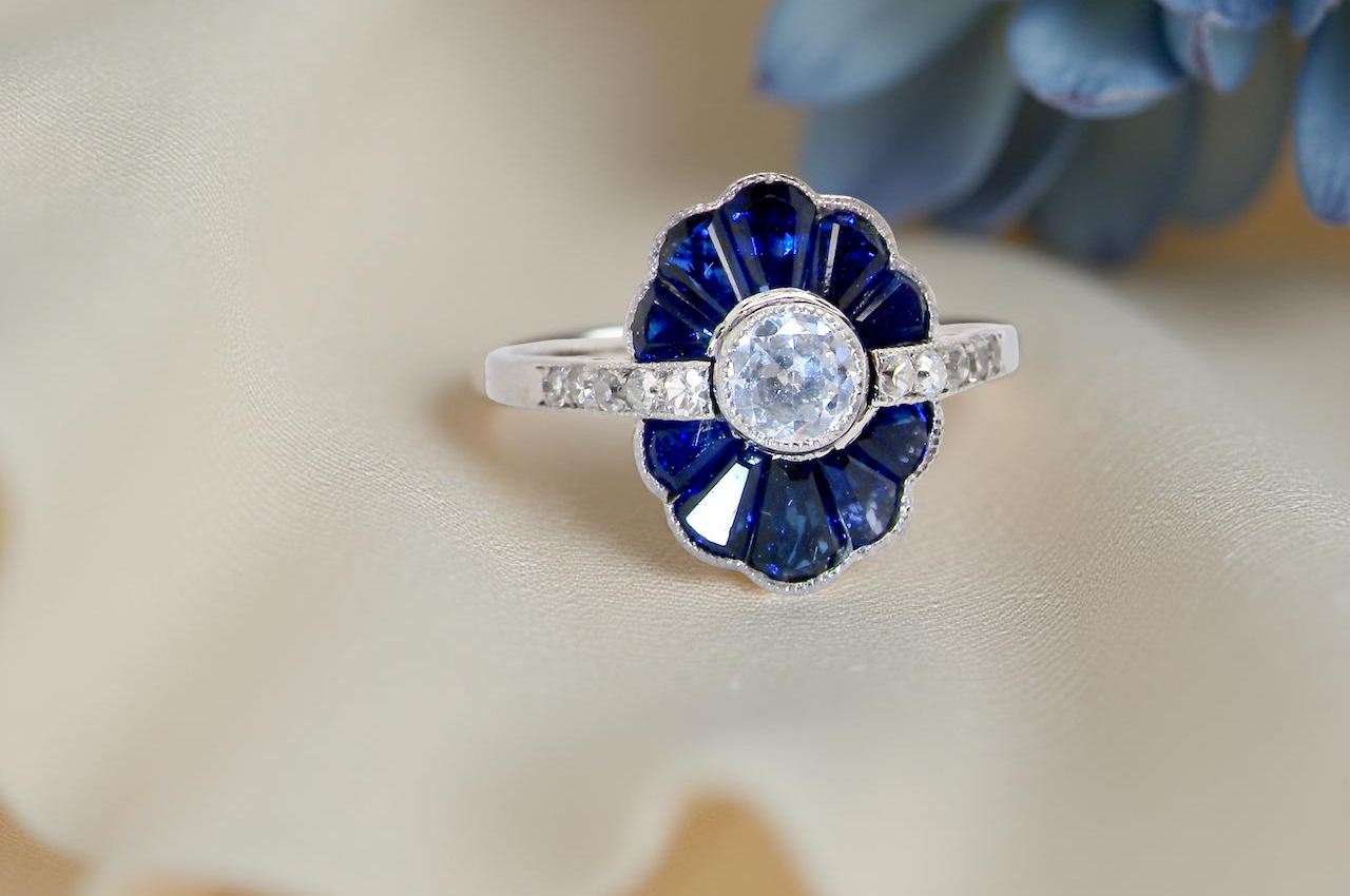 cluster ring featuring a distinctive fan-shaped design.