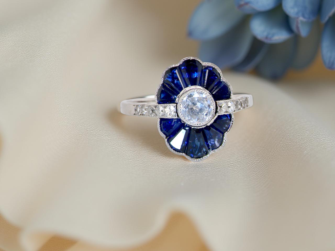 cluster ring featuring a distinctive fan-shaped design.