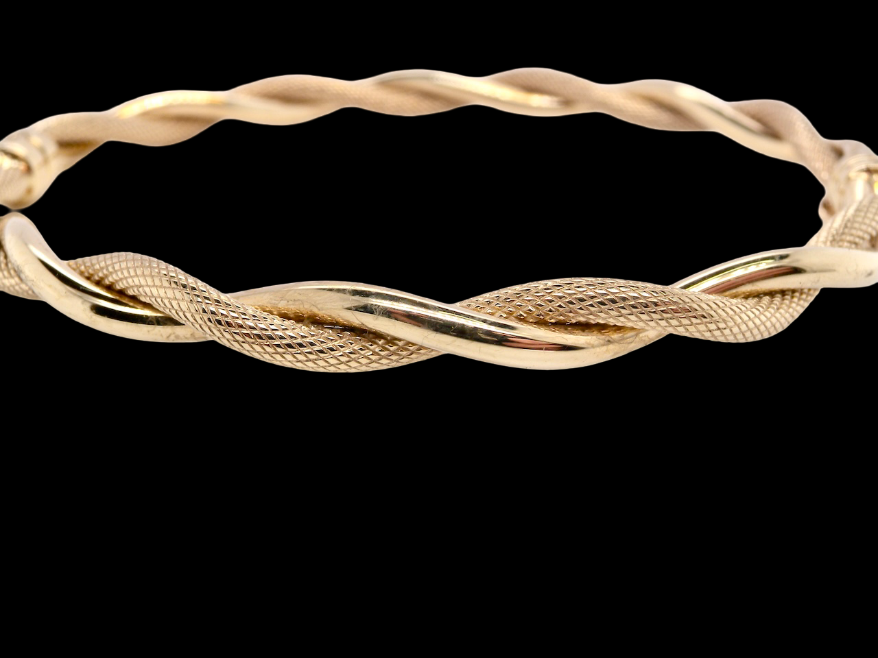 double twist of a plain band entwined around a filagree band to add strength and beauty to this very wearable piece of jewellery.