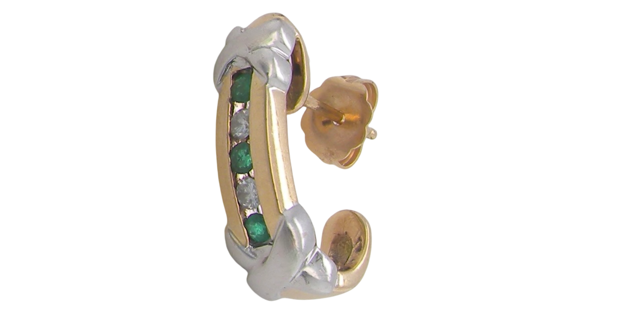 Earring half hoop style. The centre a channel set vertical row of emeralds and diamonds,