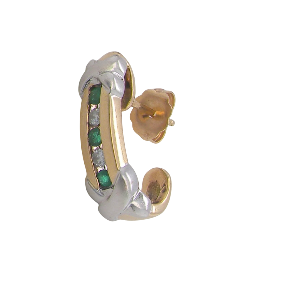 Earring half hoop style. The centre a channel set vertical row of emeralds and diamonds,