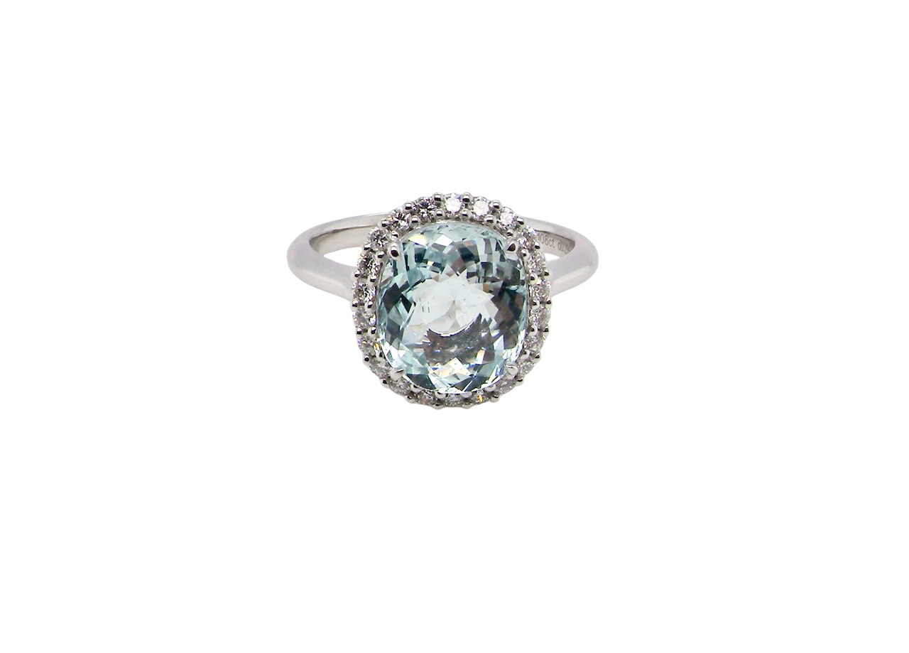 elegant cluster ring centred on a beautiful oval aquamarine,