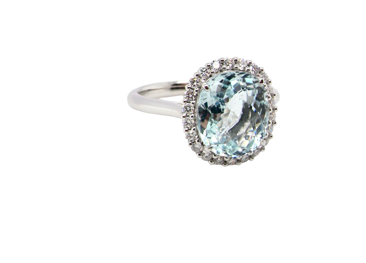 elegant cluster ring centred on a beautiful oval aquamarine, A
