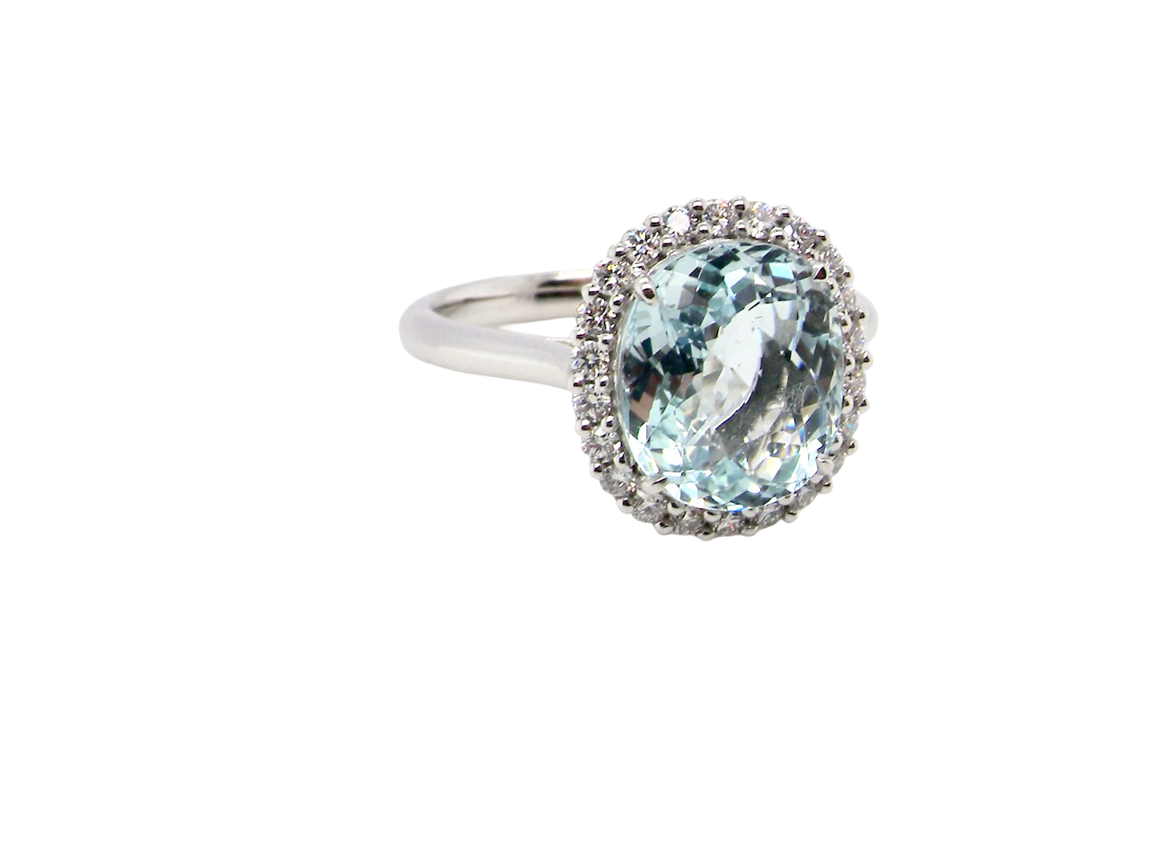 elegant cluster ring centred on a beautiful oval aquamarine, A