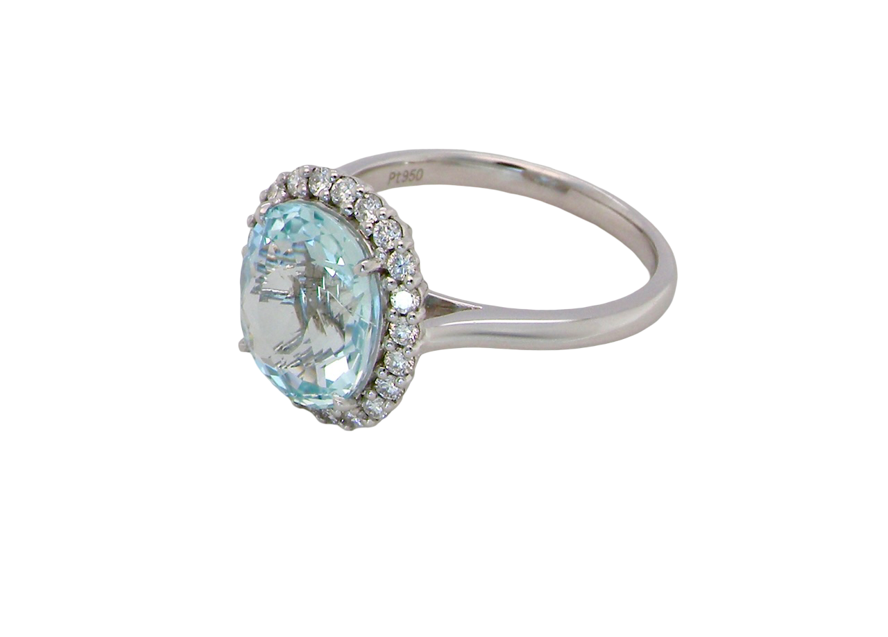 elegant cluster ring centred on a beautiful oval aquamarine, side