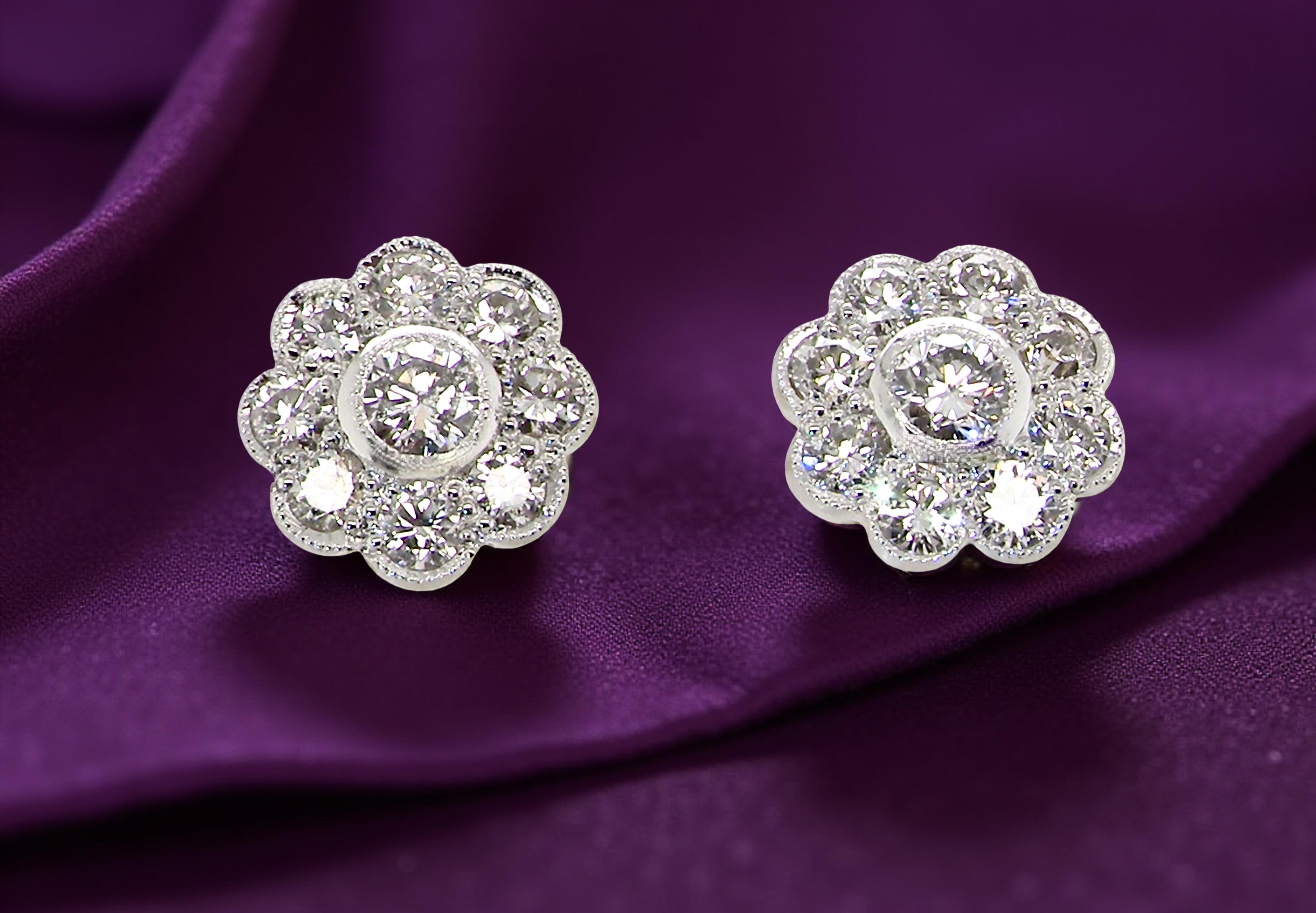 elegant pair of 18 carat gold* cluster earrings, each beautifully set with white diamonds.