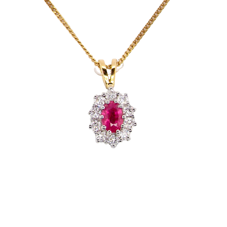 elegant pendant showcasing a vivid oval-cut raspberry-red ruby