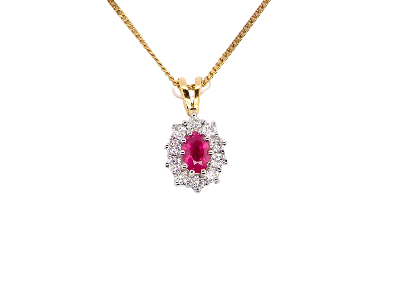 elegant pendant showcasing a vivid oval-cut raspberry-red ruby