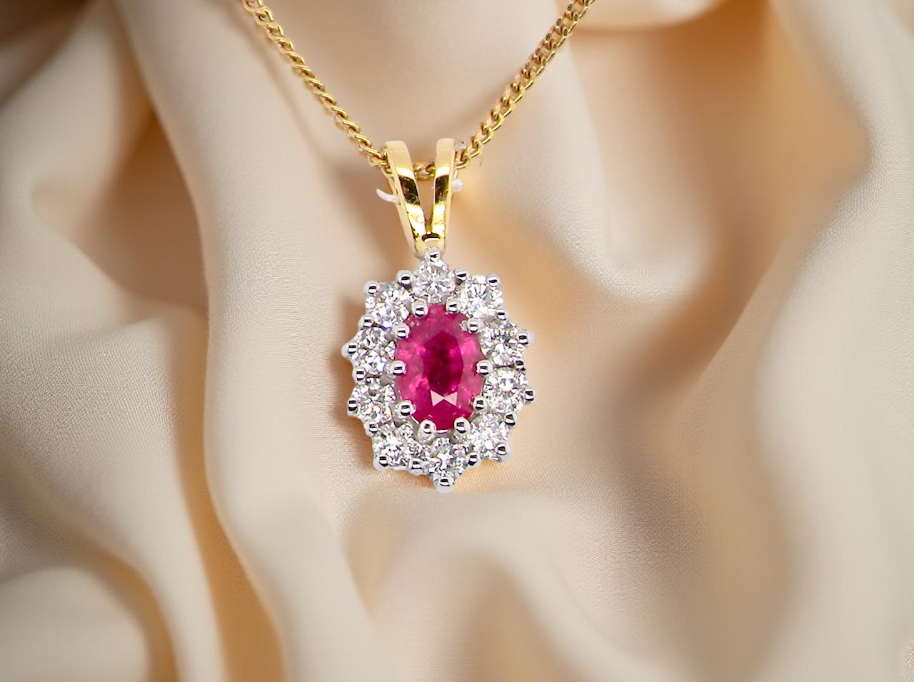 elegant pendant showcasing a vivid oval-cut red ruby