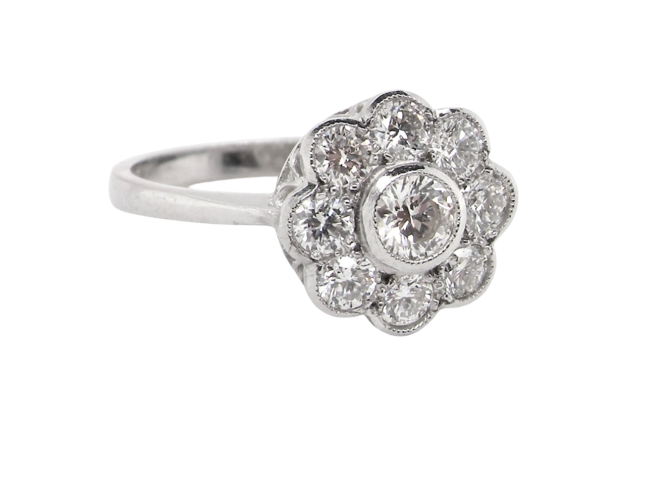 elegant vintage cluster ring crafted in platinum* and set with a diamond centre stone, 