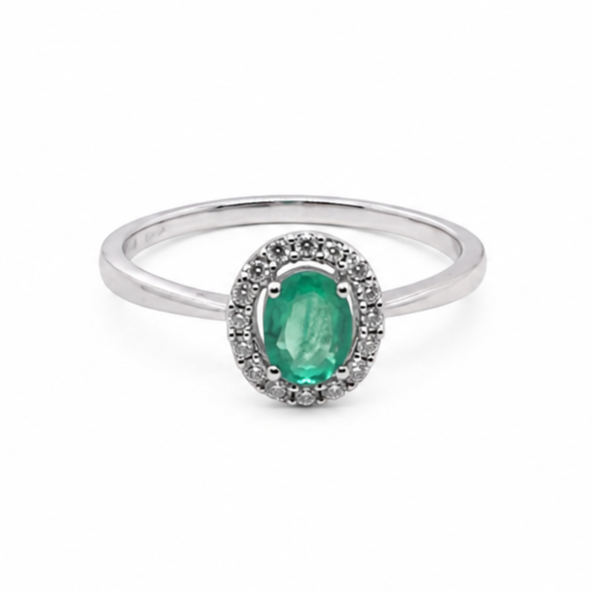 white gold ring with a green gemstone on a white background